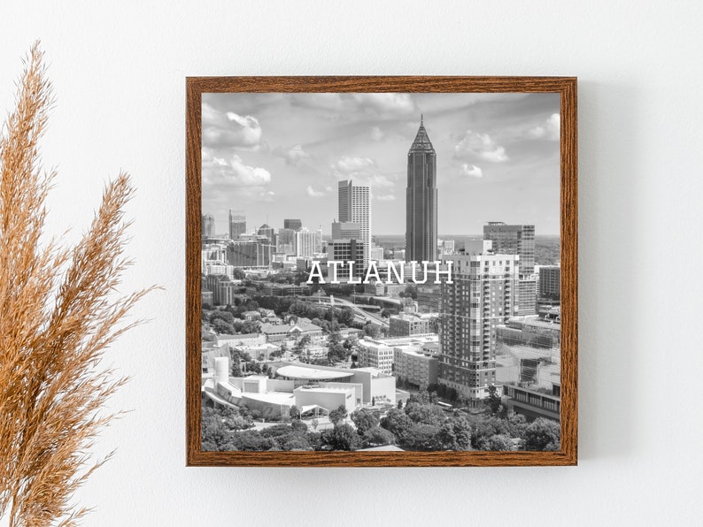 May include: Black and white photograph of the Atlanta skyline with the text "ATLANTA" printed in white.