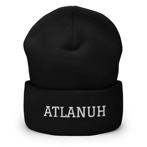 May include: Black beanie with a white embroidered word "ATLANUH" on the front.