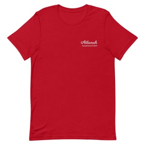 May include: Red short-sleeved t-shirt with white text that reads "Atlanuh Established 1847"