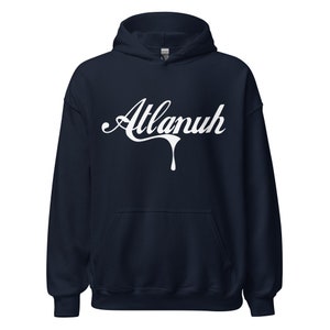 May include: A navy blue hooded sweatshirt with a white graphic of the word "Atlanuh" in a dripping font.