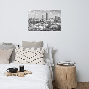 May include: Black and white aerial photograph of the Atlanta skyline with the text "ATLANTA" printed in white.
