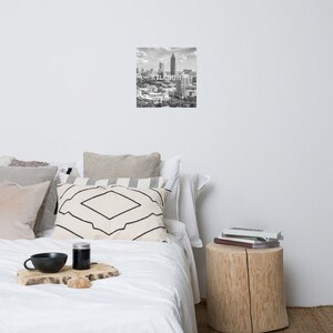 May include: Black and white photograph of the Atlanta skyline with the text "ATLANTA" superimposed over the image.