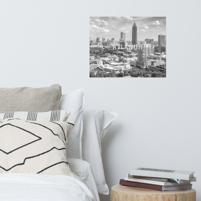 May include: Black and white aerial photograph of the Atlanta skyline with the text "ATLANTA" superimposed over the image.