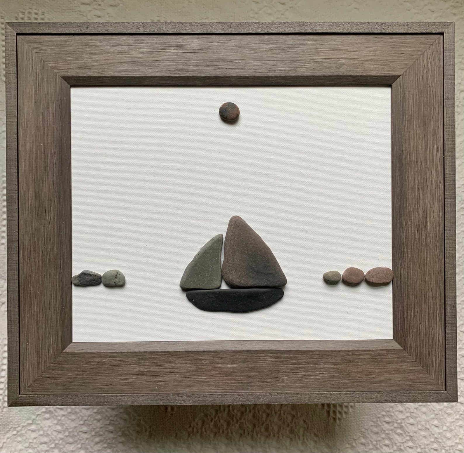 sailboat pebble art