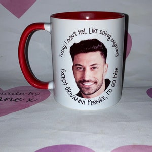 May include: White ceramic mug with a red interior and handle. The mug has a printed design featuring a man's face and the text "TODAY I DON'T FEEL LIKE DOING ANYTHING EXCEPT GIOVANNI PERNICE, I'D DO HIM".