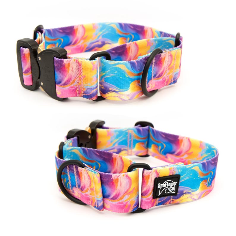 May include: A dog collar featuring a vibrant, swirling marble pattern in shades of blue, pink, and yellow. It includes a black metal buckle, black hardware rings, and a black rectangular patch with the white text SeaFlower Co.