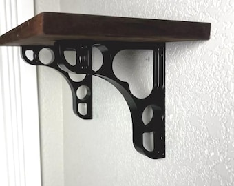 Two machined 1" wide black aluminum shelf brackets 5.75 x 6.25
