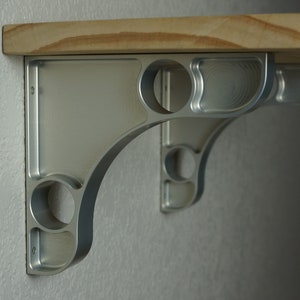 Two machined 1" wide large pocket aluminum shelf brackets 5.75 x 6.25
