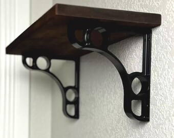 Two machined 1" wide black aluminum shelf brackets 5.75 x 6.25