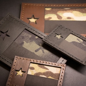 May include: Four different sizes of Texas flag patches. The patches are made of brown leather with a camouflage fabric insert. The patches have a star cut out in the top left corner.