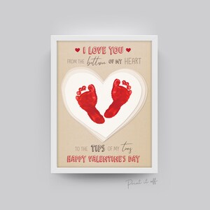 May include: A printable Valentine's Day card with a red heart shape made from two red baby footprints. The text reads "I love you from the bottom of my heart to the tips of my toes Happy Valentine's Day".