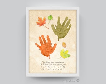 May include: A printable art print with a handprint design featuring autumn leaves in shades of orange, green, and yellow. The print includes a poem about autumn leaves and the text "Print it off".