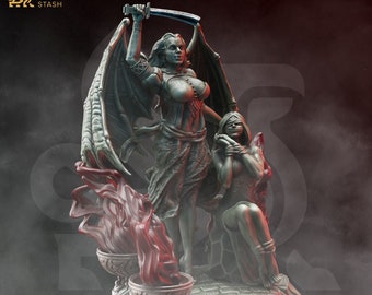 May include: A detailed miniature figurine of a female demon with wings holding a sword over a bound female figure. The demon is standing on a base with a flaming chalice.