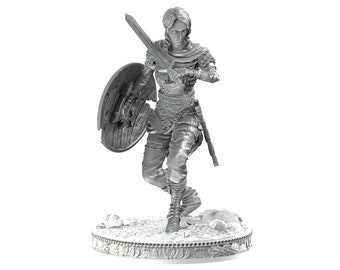 May include: A grey, detailed miniature figurine of a person in armour holding a sword and shield. The figurine is standing on a circular base with a decorative design.