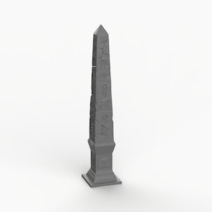 May include: A gray stone obelisk with hieroglyphics carved into its surface. The obelisk is on a square base and has a pointed top.