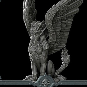 May include: A grey, detailed, sculpted sphinx with wings, a human-like head, and a lion body. The sphinx is wearing a crown and a necklace. The sculpture is labelled "SPHINX".