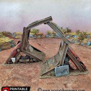May include: A 3D printed model of a collapsed bridge made of metal and wood. The bridge is partially covered in rust and dirt. The bridge is supported by two cars that are also partially covered in rust and dirt. The model is painted in shades of brown, gray, and red.