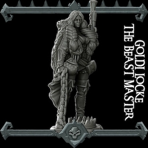 May include: A gray painted miniature figurine of a female character with long hair, wearing a fur-lined coat and holding a chain and a weapon. The figurine is standing on a base with a skull design. The text "GOLDILOCKE THE BEAST MASTER" is visible in the background.