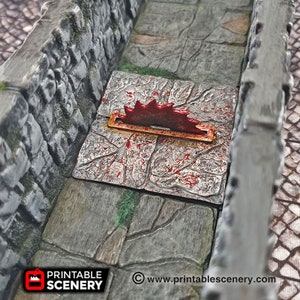 May include: A red and gold metal saw blade trap on a gray stone floor with red blood splatters. The trap is set in a narrow stone hallway.