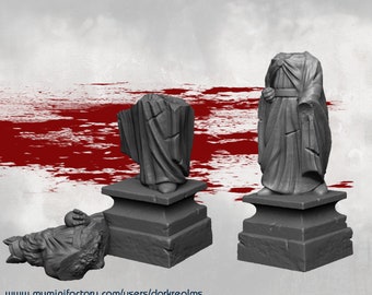 Puede incluir: Tres estatuas en miniatura impresas en 3D de figuras con túnicas, dos de pie sobre bases cuadradas y una tumbada de lado. Las estatuas son grises y tienen una superficie rugosa y texturizada. El fondo es un rojo borroso.