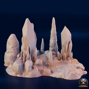 May include: A light beige, 3D-printed terrain piece featuring a cluster of crystalline structures and rock formations. The piece includes several tall, pointed crystals and smaller, jagged rocks, suitable for tabletop gaming or display.