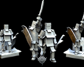 May include: Three cardboard figures of knights, each wearing armor and holding a sword and shield. The figures are standing on a base made of cardboard.