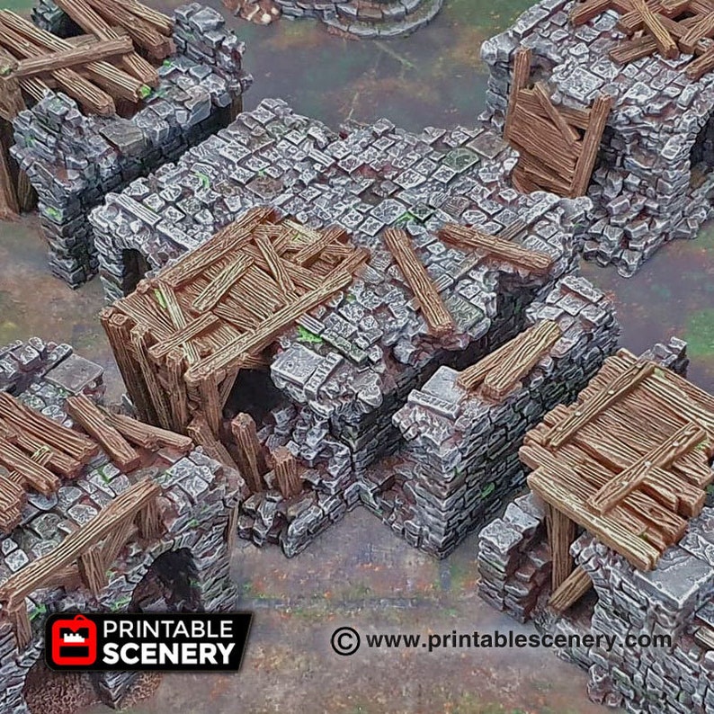 May include: A set of four gray stone ruined building sections with wooden beams and planks. The sections are designed to be used together to create a ruined building for tabletop gaming.