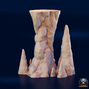 May include: A beige, 3D-printed rock formation with a large central pillar and several smaller stalagmites. The textured surface suggests a cave or canyon setting. The base is flat, and the overall design is suitable for tabletop gaming or model scenery.