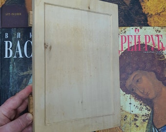 May include: A light wood frame with a raised edge and a smooth surface. The frame is blank and ready for a picture or artwork.