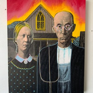 May include: A painting depicting the iconic "American Gothic" couple. The artwork features a man holding a pitchfork and a woman, both in front of a house with a church-like window. The background has a sunset with red and yellow hues.