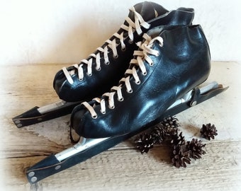 Great old black ice skates with patina for decoration