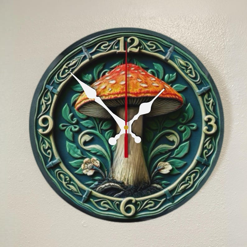 May include: Round wall clock featuring a detailed mushroom design. The clock face has a dark teal background with a large orange and white mushroom in the center. White clock hands point to the time. The clock is a decorative home decor item.