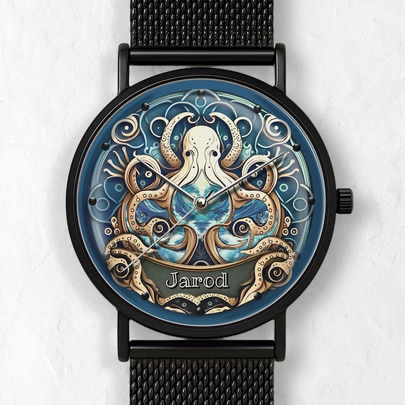 May include: Black wristwatch with a blue face featuring a detailed octopus design. The watch face has a blue background with a white and gold octopus illustration. The watch band is black mesh, and the name "Jarod" is displayed on the face.