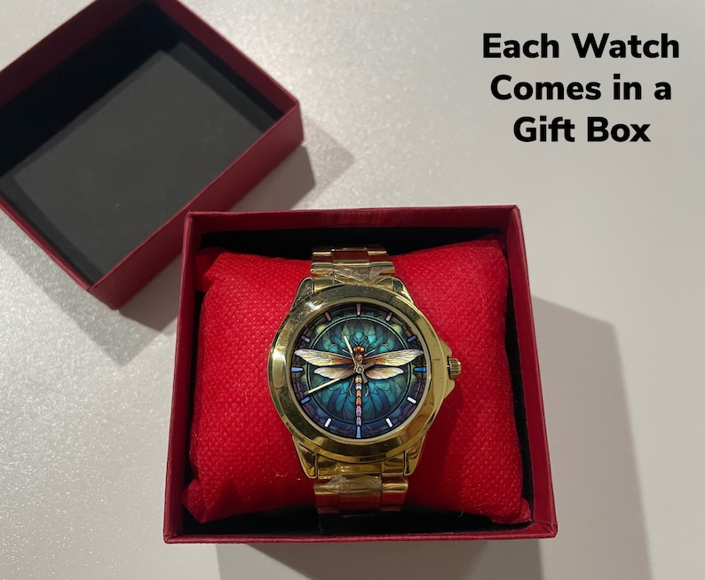 May include: A gold-tone wristwatch with a dragonfly design on the face. The watch comes in a red gift box. Each Watch Comes in a Gift Box.