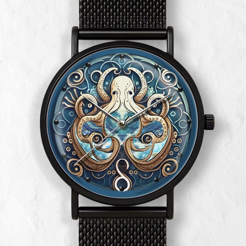 May include: Black wristwatch with a round face featuring an octopus design. The watch face has a blue background with a detailed illustration of an octopus in cream and gold tones. The watch has a black mesh band.