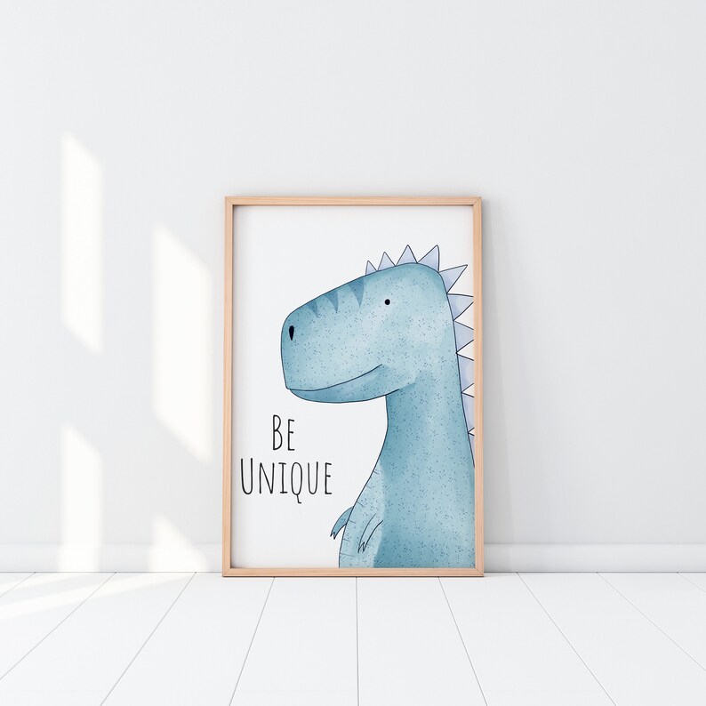 May include: A framed print with a blue watercolor illustration of a dinosaur with the text "BE UNIQUE" underneath.