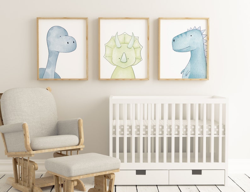 May include: Three framed watercolor illustrations of dinosaurs. The illustrations are in a nursery setting with a rocking chair and a crib.