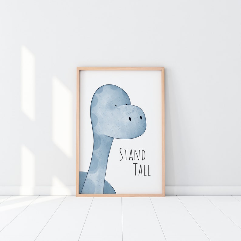 May include: A framed print with a blue watercolor illustration of a dinosaur's head and the text "STAND TALL".