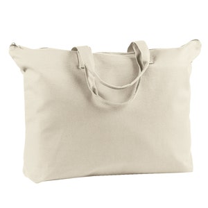 May include: A large, off-white canvas tote bag with zipper closure and two fabric handles.