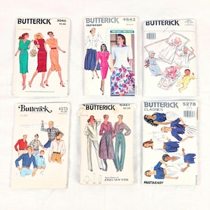 May include: Six vintage Butterick sewing pattern envelopes arranged in two rows. The patterns feature illustrations of various clothing styles including dresses, skirts, blouses, shirts, and infant wear, with printed model numbers 3040, 4643, 3317, 4575, 6327, and 5278.
