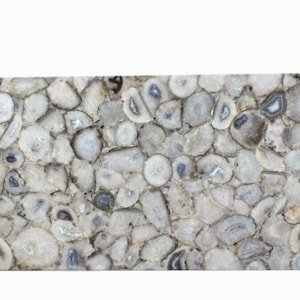 May include: A rectangular slab featuring a mosaic of polished, light gray and white agate stone slices. The surface displays a dense arrangement of circular and irregular stone cross-sections with varied translucent and opaque textures.
