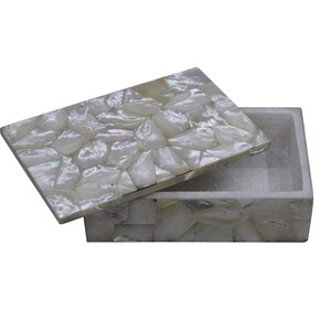 May include: A rectangular box with a hinged lid, crafted from iridescent, mosaic-like pieces. The box is open, revealing the interior. The lid is slightly ajar, showcasing the pearlescent, white and cream-colored surface.