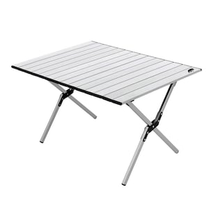 May include: A silver folding camping table with a slatted tabletop and black trim. The table has silver legs that fold for easy storage and transport. The table is designed for outdoor use and features a bear logo.
