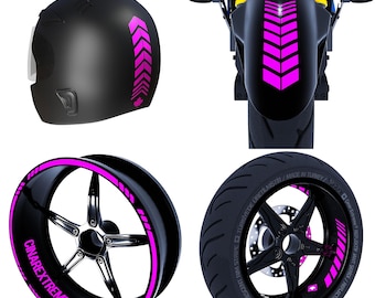 May include: Pink reflective motorcycle wheel rim tape with the text "CINAREXTREME" and a Canadian flag. The tape is shown on a black motorcycle wheel rim.