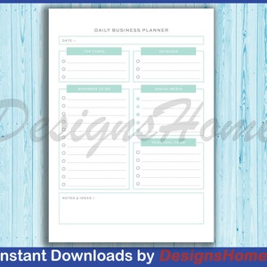 May include: A printable daily business planner with sections for top three priorities, invoices, business to do, social media, personal to do, and notes and ideas. The planner has a light blue and white color scheme.