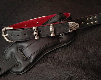 Guitar strap with rings and studs