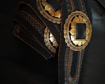 Black reptile guitar strap with conchos