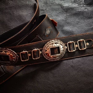 Leather guitar strap with silver conchos