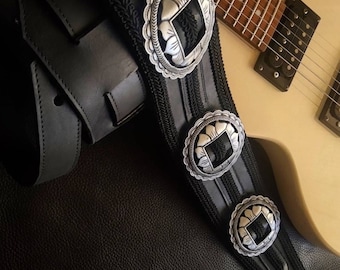 Black strap for guitar or bass with buckles and trimmings