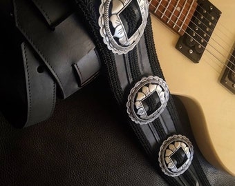 Black strap for guitar or bass with buckles and trimmings